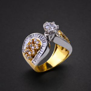 Gold Bypass Ring — Solitaire and Baguette Teardrop
