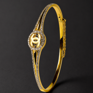 Gold Bangle Bracelet — Pointed Pavé, Interlock Emblem