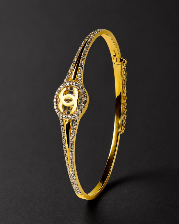 Gold Bangle Bracelet — Pointed Pavé, Interlock Emblem